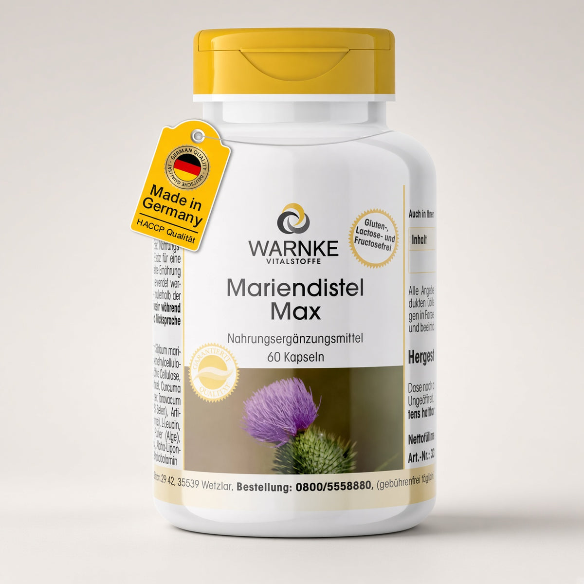 Mariendistel Max – 60 kapsler i en hvit og gul flaske med violette blomsterillustrasjoner. 100% vegansk og allergivennlig.