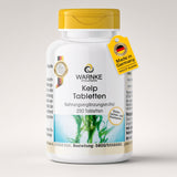 Kelp-tabletter i en hvit beholder med gult lokk, med 250 tabletter, og grønne alger på etiketten.