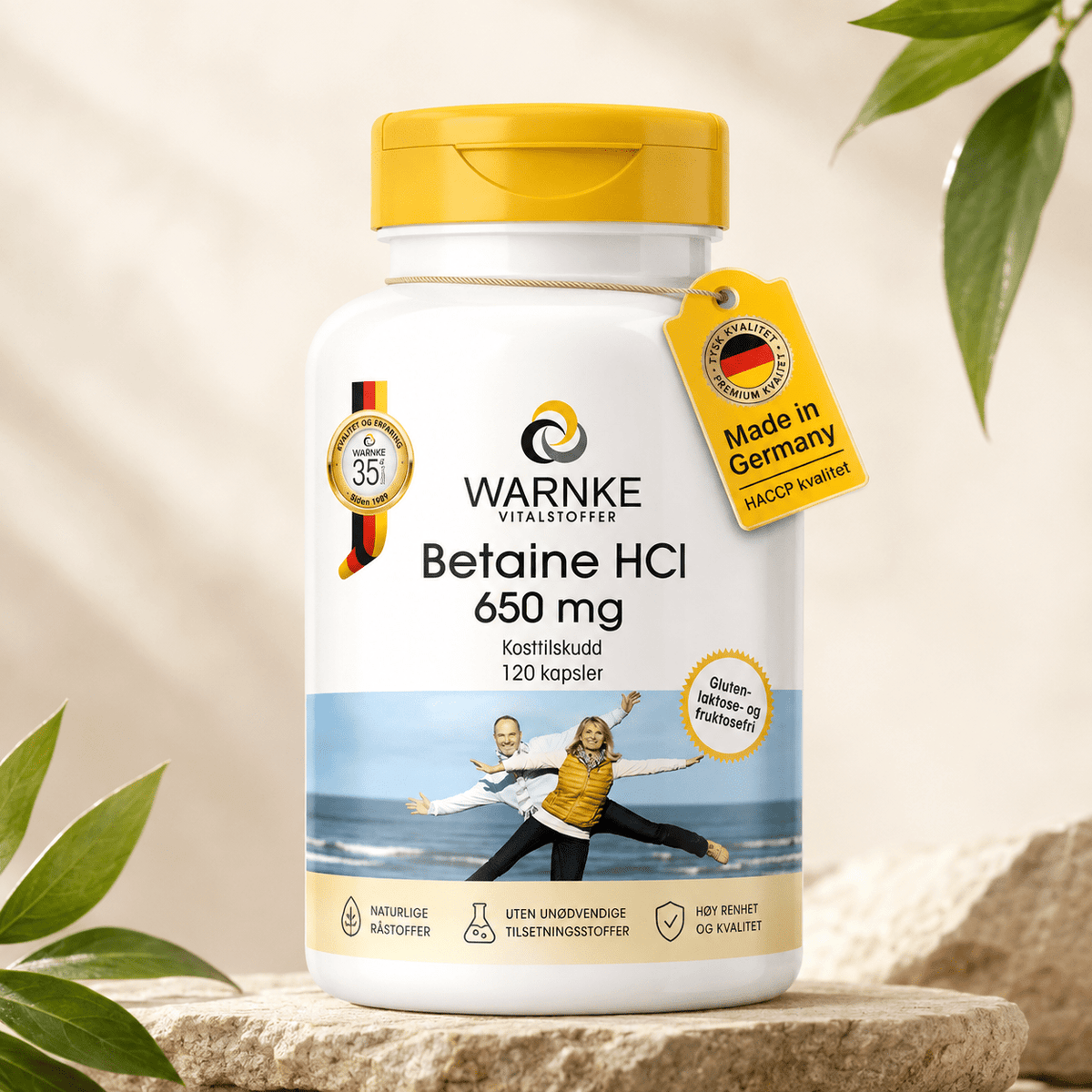 Betaine HCl 650 mg kapsler i en hvit beholder med gult lokk, etikett med detaljer om produkt og opprinnelse.