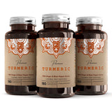Tre brune flasker med vegetabilske kapsler, etikett med teksten "Premium Turmeric" og oransje detaljering.